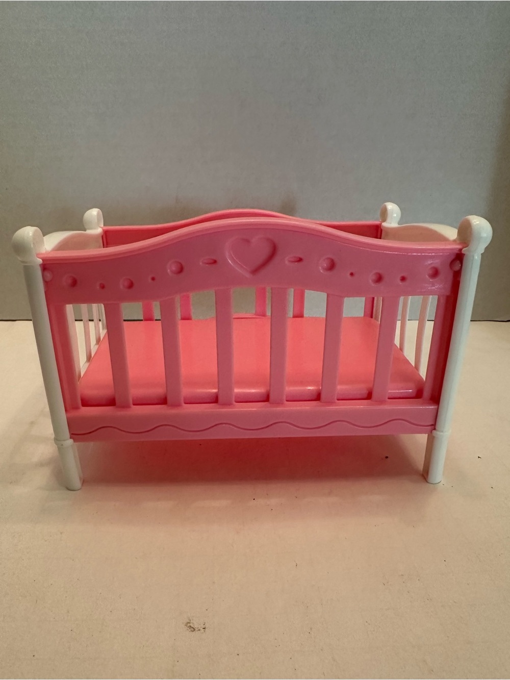 Vintage Pink Plastic Doll Crib with Heart Detail